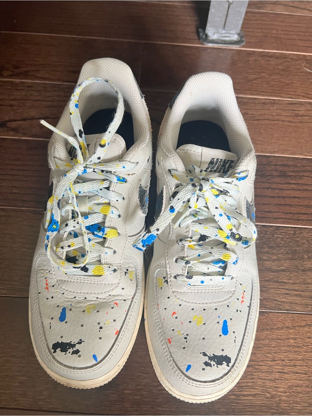 Nike White Sneakers with Blue, Yellow, Black & Red Paint-Splatter